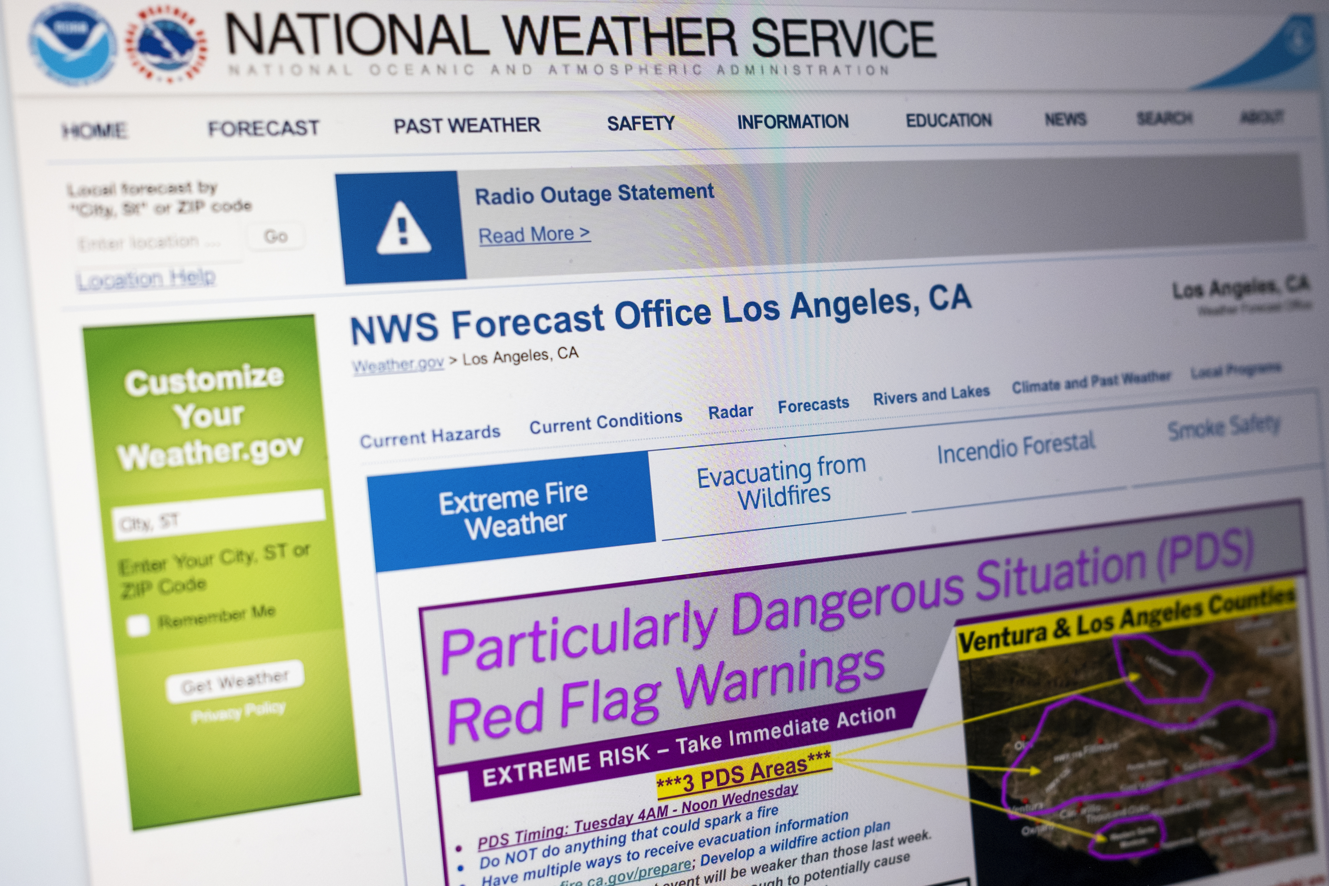 A "Particularly Dangerous Situation" red flag warning appears on the National Weather Service's website for Los Angeles due to the extreme risk of wildfires in the region, Monday, Jan. 13, 2025. (AP Photo/Rachel Leathe)