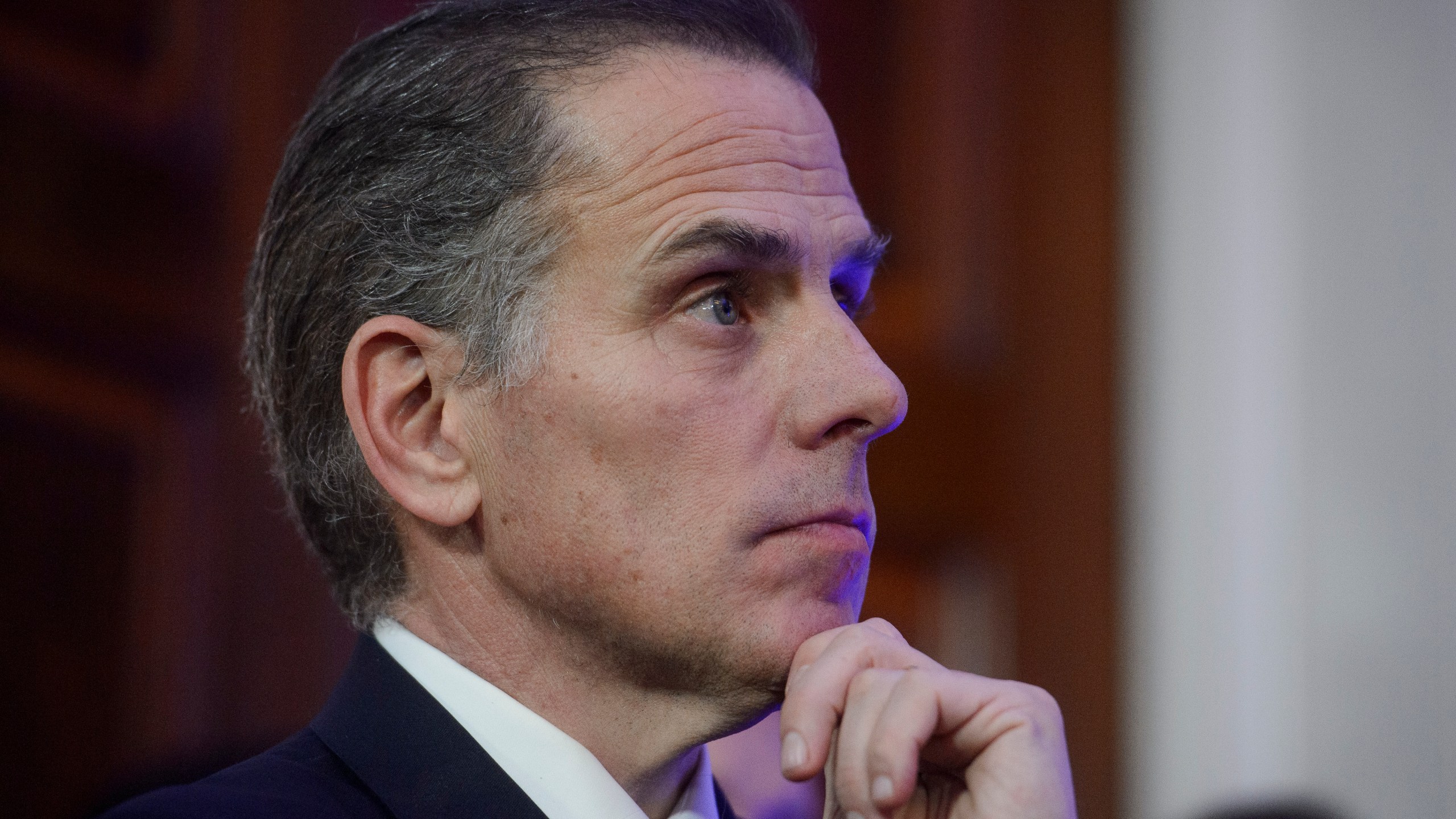 Hunter Biden listens while his father, President Joe Biden, speaks during a Hanukkah reception in the East Room of the White House in Washington, Monday, Dec. 16, 2024. (AP Photo/Rod Lamkey, Jr.)