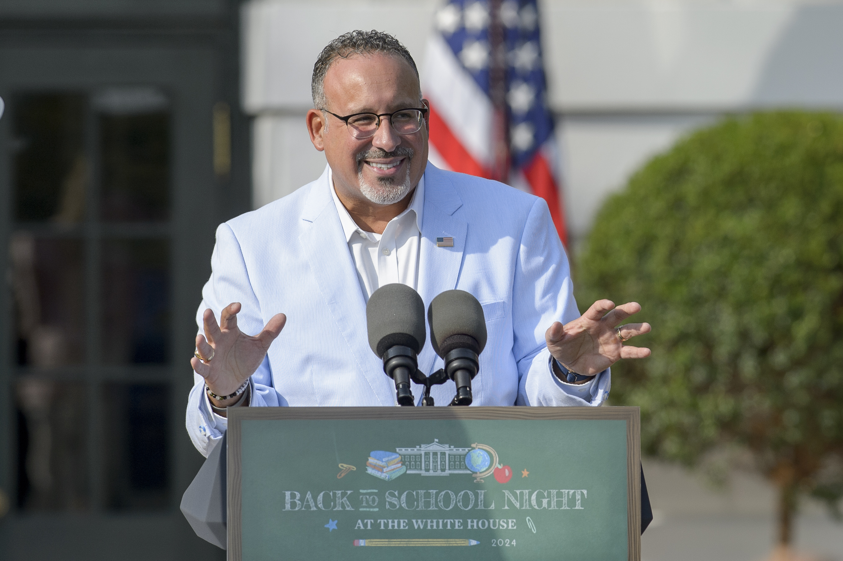 FILE - U.S. Secretary of Education Miguel Cardona offers remarks at the first-ever Back-to-School Night at the White House on the South Lawn of the White House in Washington, Sept. 21, 2024. (AP Photo/Rod Lamkey, Jr., File)