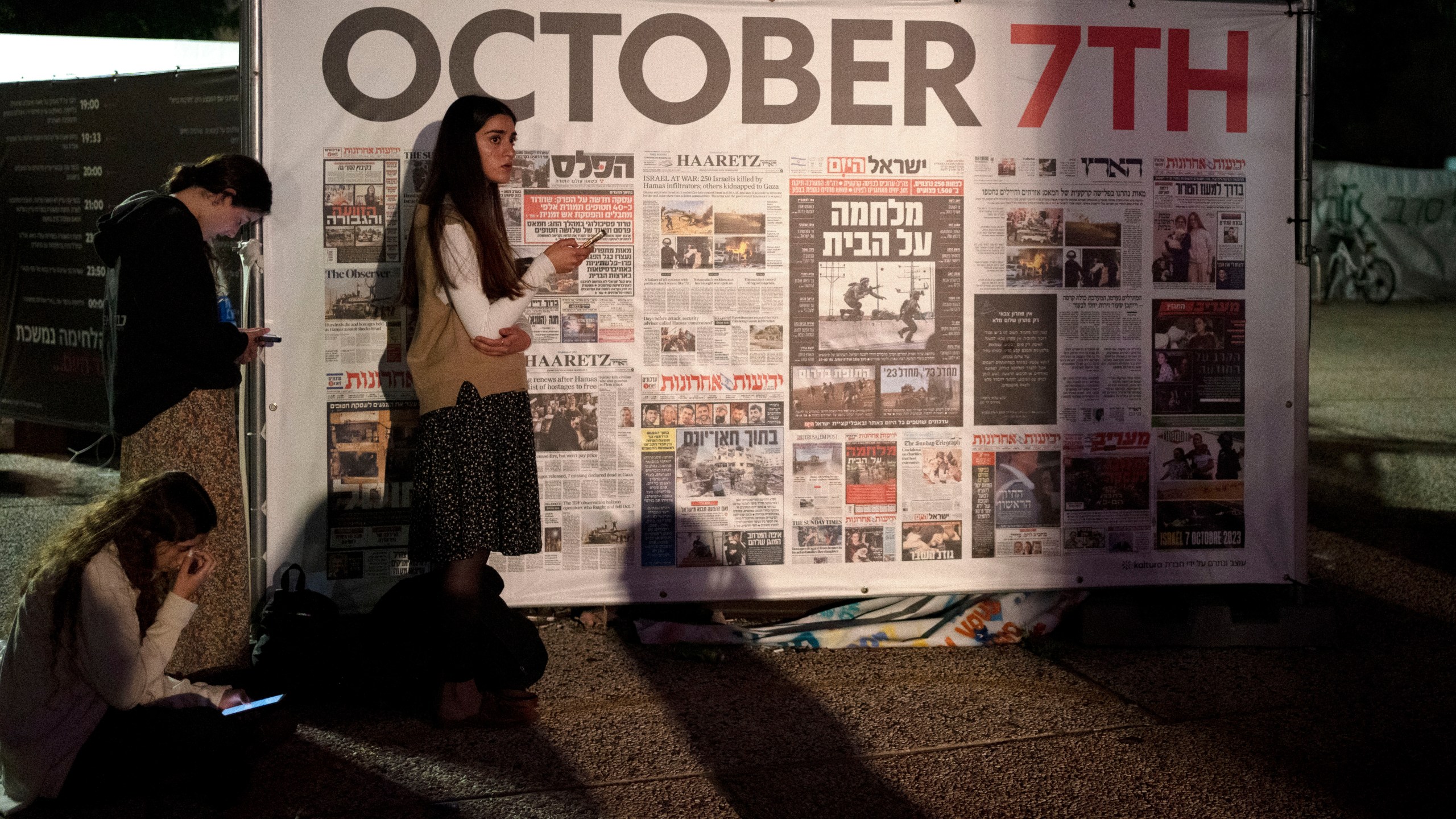 Young women participate in a rally to free hostages held by Hamas militants in the Gaza Strip, in Tel Aviv, Israel, Tuesday, Jan. 14, 2025. (AP Photo/Maya Alleruzzo)