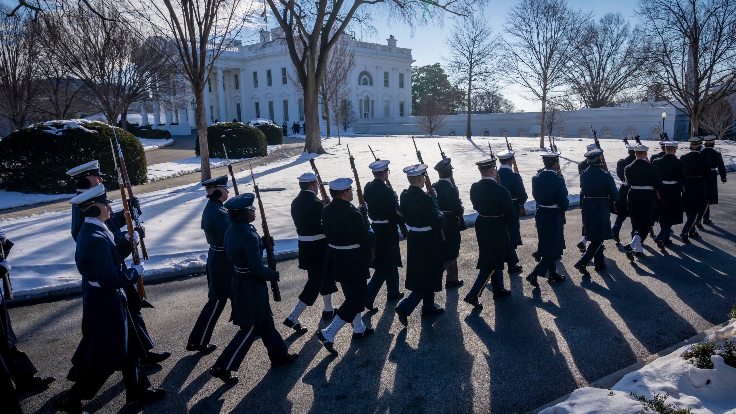 Members of the U.S. military Joint Honor Guard parade as they rehearse ahead of the upcoming presidential inauguration, at the North Lawn in front of the White House in Washington, Sunday, Jan. 12, 2025. (AP Photo/Ben Curtis)