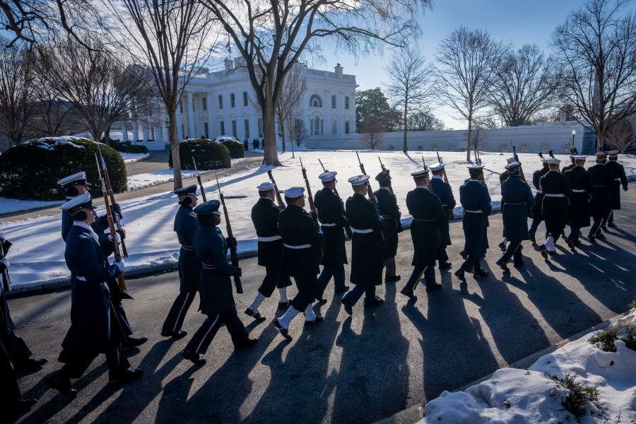 Members of the U.S. military Joint Honor Guard parade as they rehearse ahead of the upcoming presidential inauguration, at the North Lawn in front of the White House in Washington, Sunday, Jan. 12, 2025. (AP Photo/Ben Curtis)