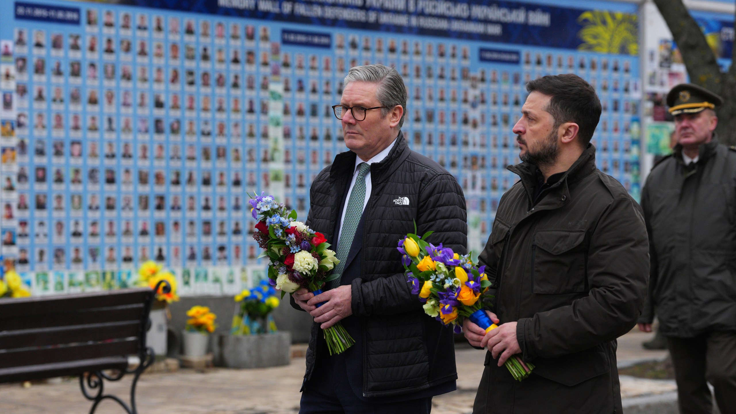 British Prime Minister Keir Starmer and Ukrainian President Volodymyr Zelenskyy arrive to lay wreaths at The Wall of Remembrance of the Fallen for Ukraine in Kyiv, Ukraine Thursday, Jan. 16, 2025. (Carl Court/Pool Photo via AP)