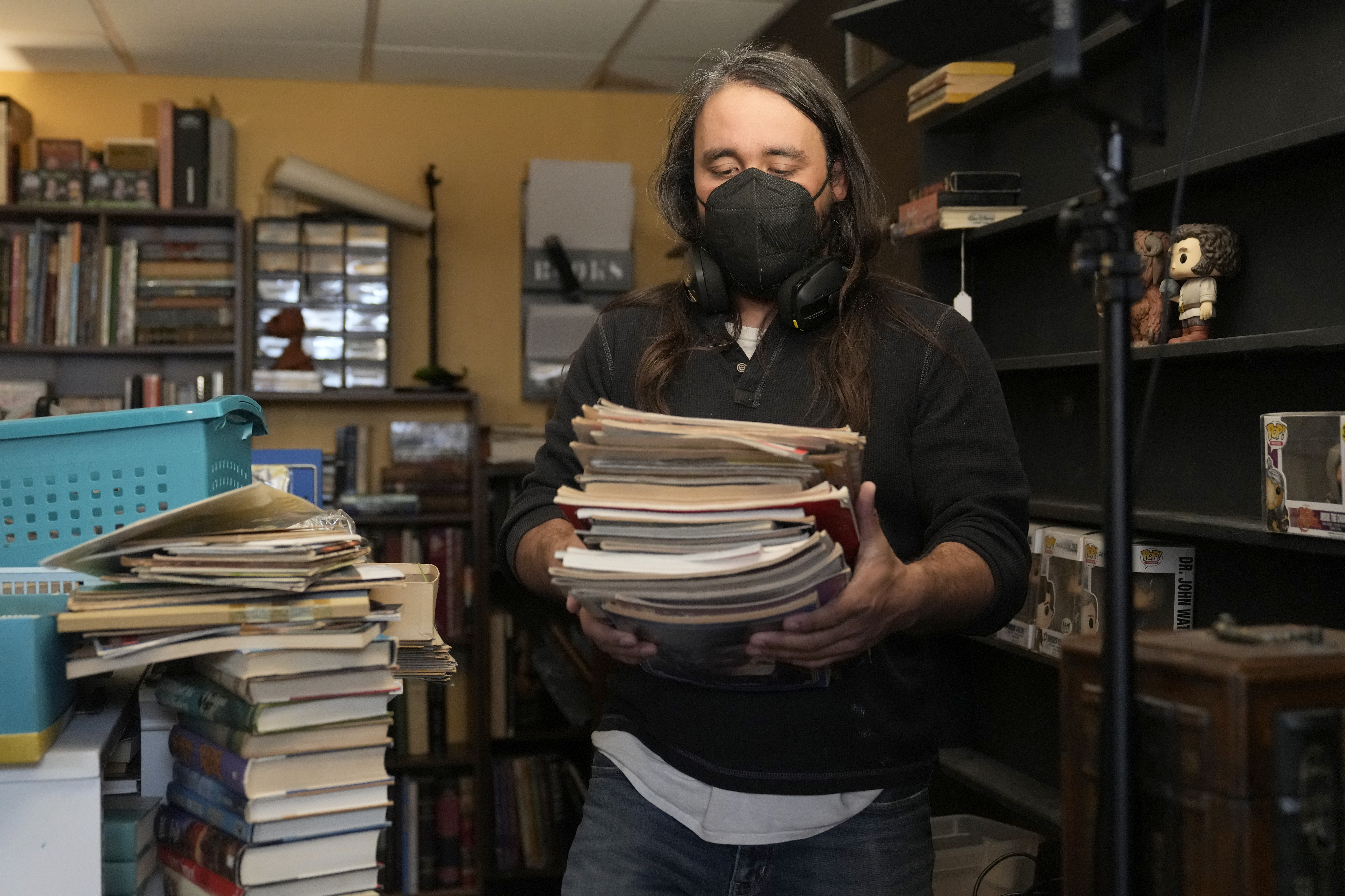 Steve Alejandro works in his office near the room where his wife, Ashley, spends most of her time due to illness in the basement of their home Wednesday, Dec. 18, 2024, in Wentzville, Mo. (AP Photo/Jeff Roberson)