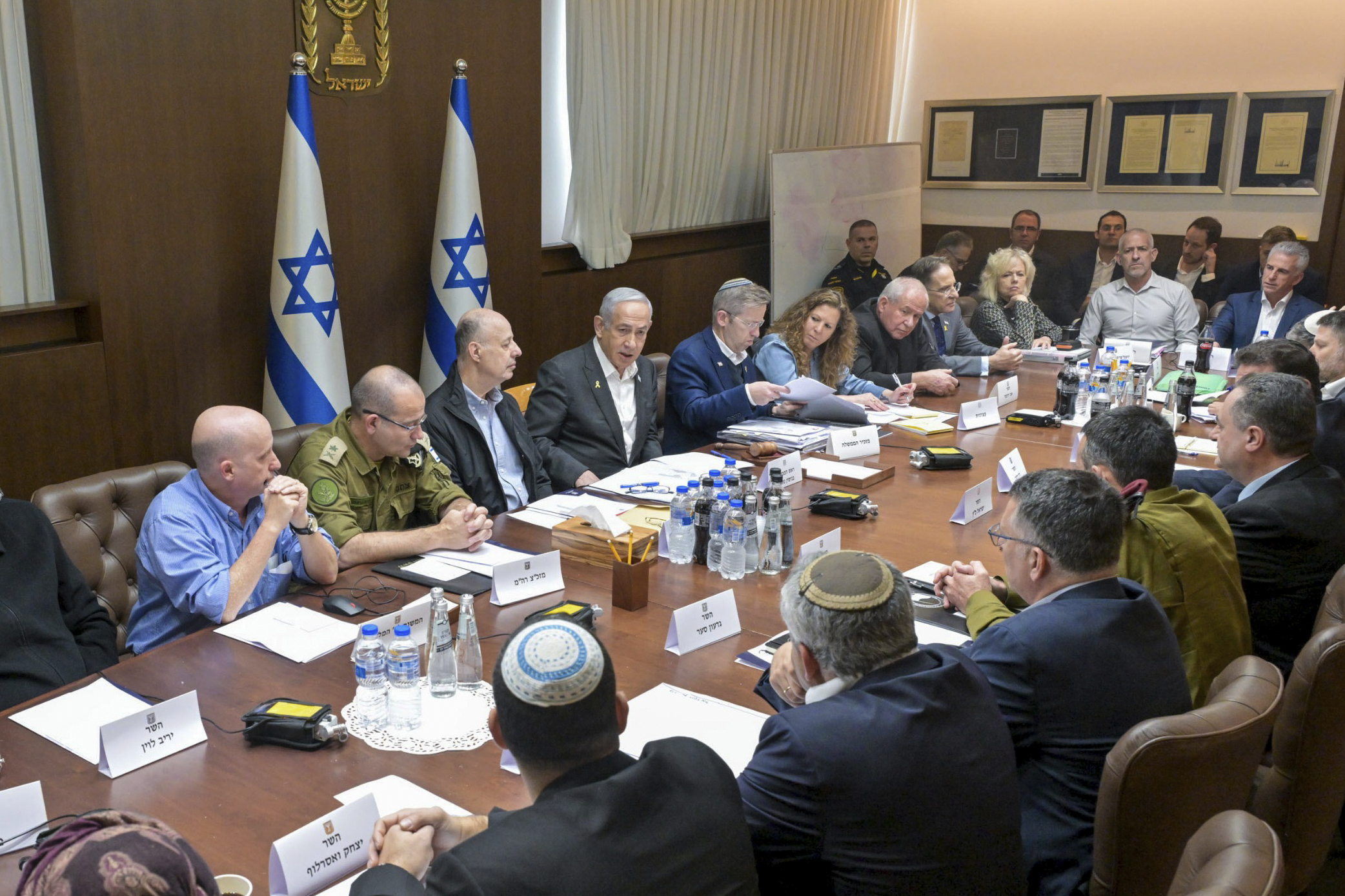 This photo provided by the Israeli Government Press Office, Israeli Prime Minister Benjamin Netanyahu, center, convened his security Cabinet to vote on a ceasefire deal after confirming an agreement had been reached that would pause the 15-month war with Hamas in Gaza, in Jerusalem, Friday, Jan. 17, 2025. (Koby Gideon/Israeli Government Press Office via AP)