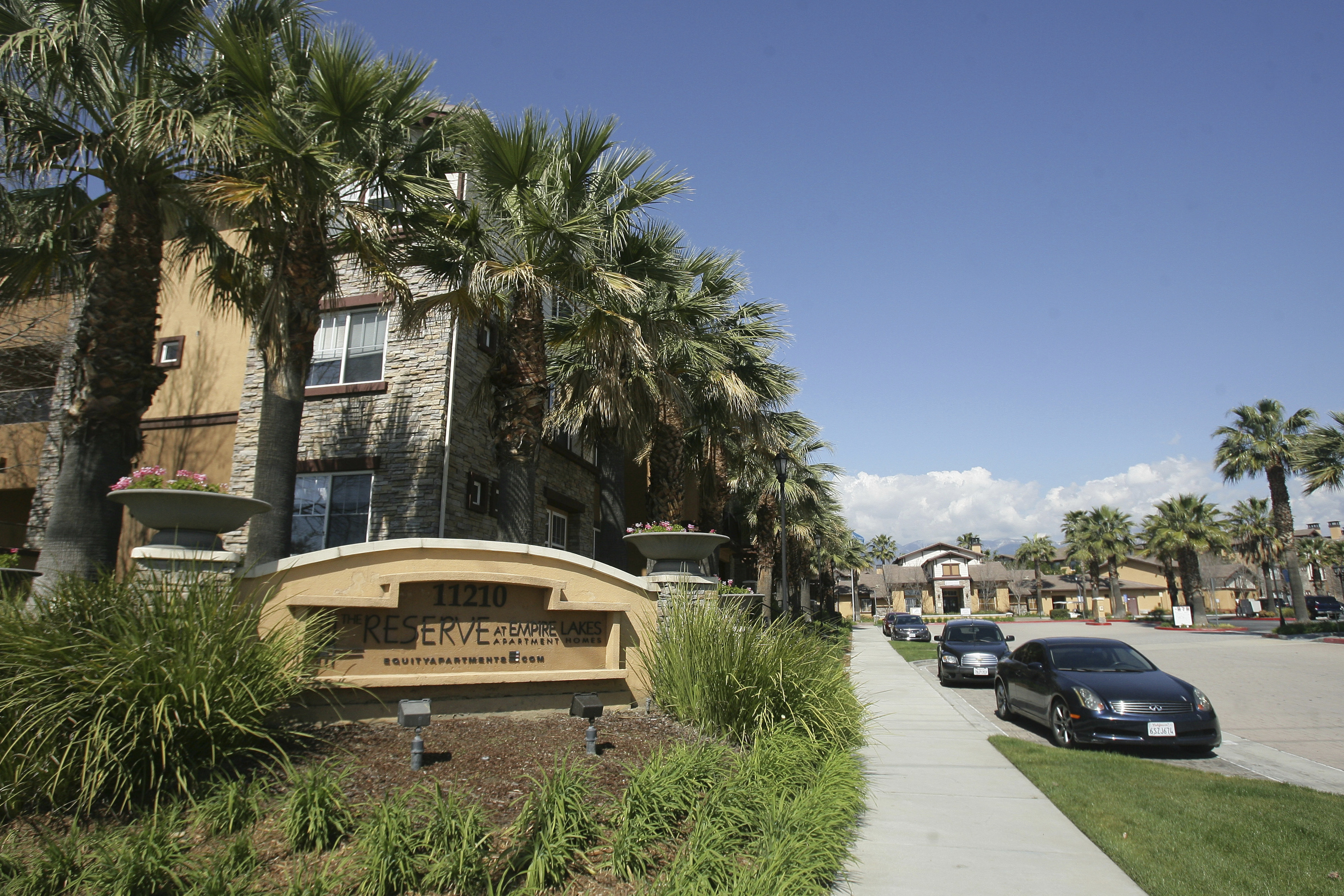 FILE - Federal agents raided about 20 locations, related to a birth tourism scheme, in three Southern California counties, including this apartment complex in Rancho Cucamonga, Calif., Tuesday, March 3, 2015. (Stan Lim/The Press-Enterprise via AP,File)