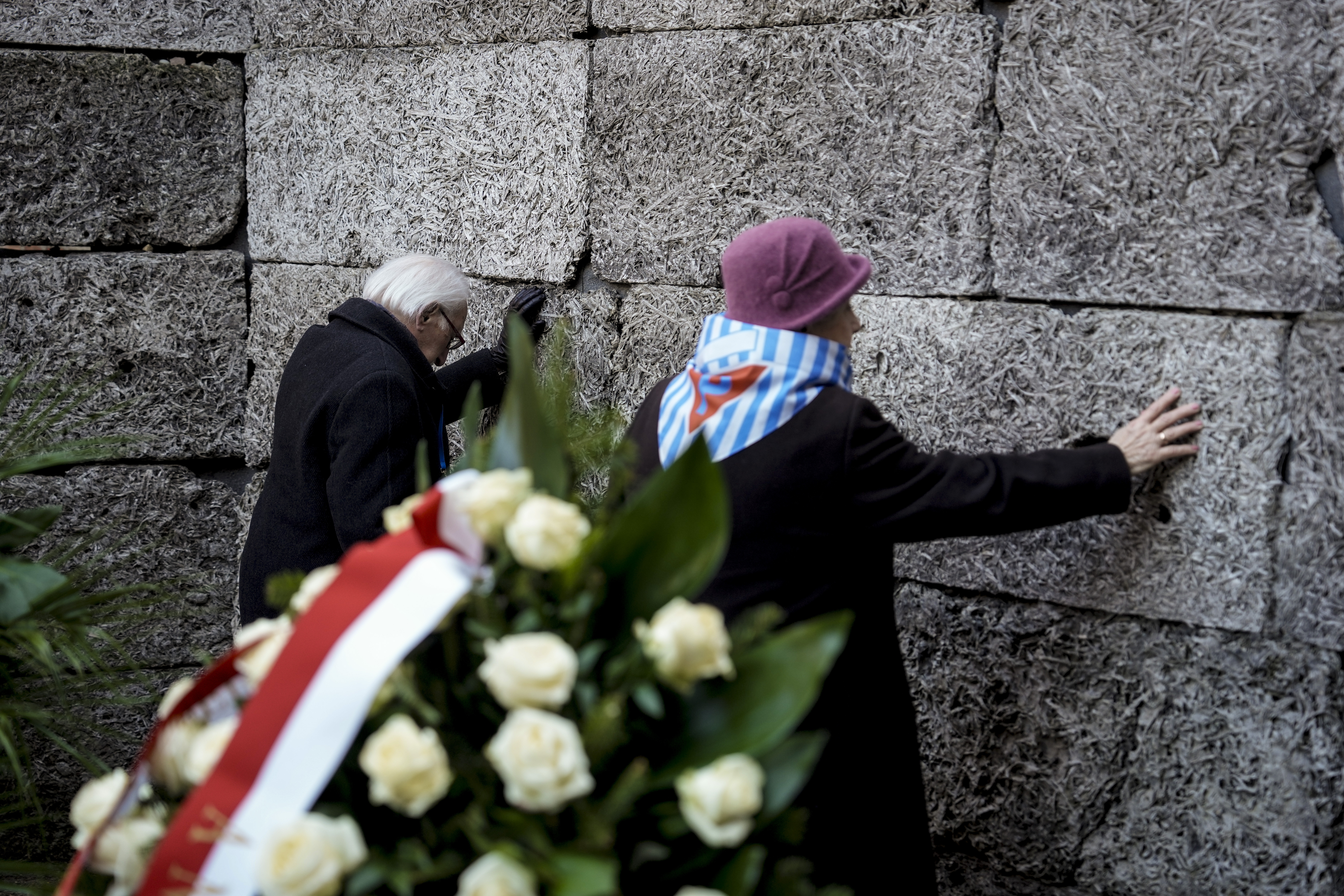 Survivors and relatives attend a ceremony at the Auschwitz-Birkenau former Nazi German concentration and extermination camp, in Oswiecim, Poland, Monday, Jan. 27. 2025.(AP Photo/Oded Balilty)