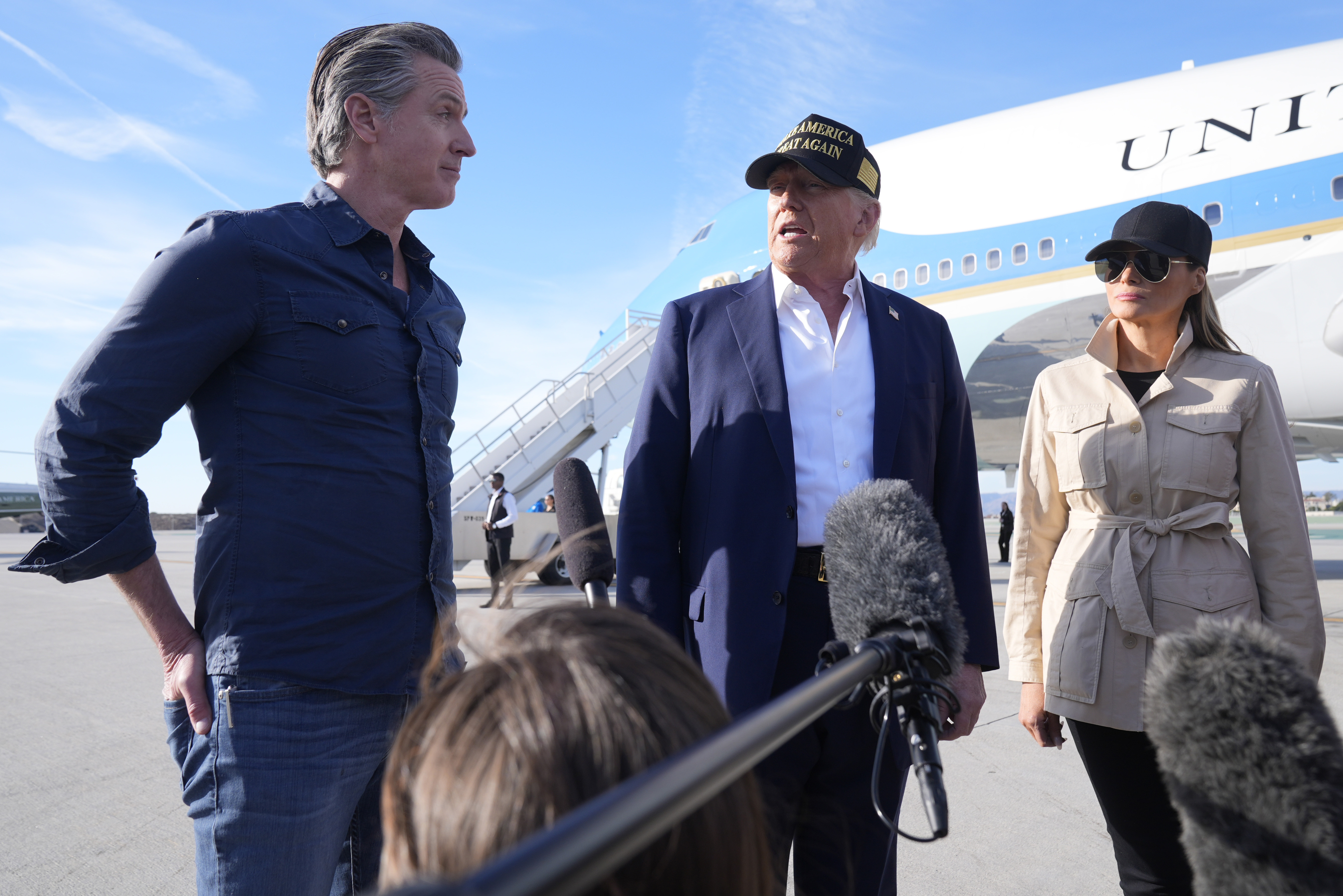 FILE - President Donald Trump speaks as first lady Melania Trump and California Gov. Gavin Newsom listen, after arriving on Air Force One at Los Angeles International Airport in Los Angeles, Friday, Jan. 24, 2025. (AP Photo/Mark Schiefelbein, File )