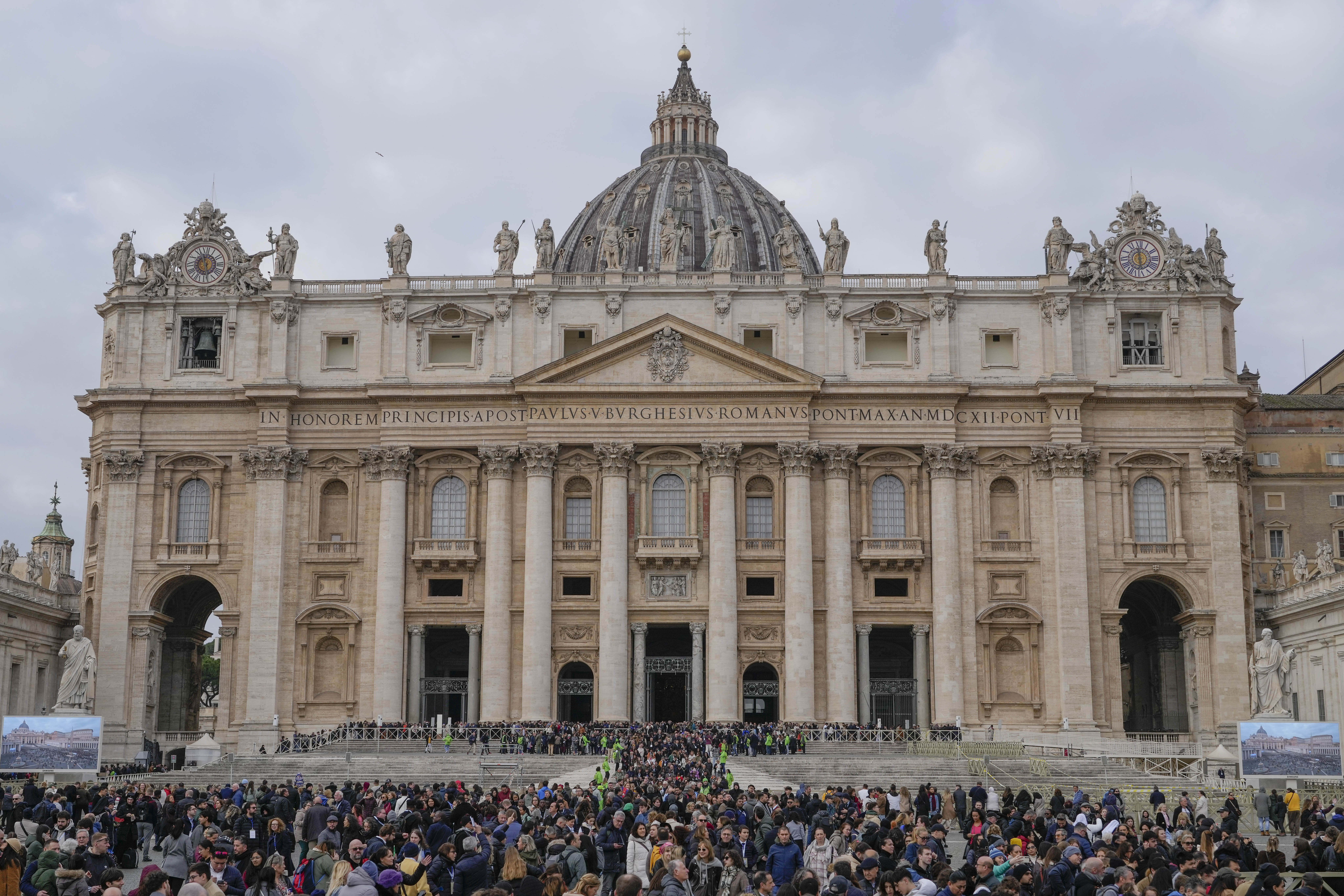 Faithful leave St. Peter's Basilica at the end of a mass presided by Pope Francis at the Vatican, Sunday, Jan. 26, 2025. (AP Photo/Gregorio Borgia)