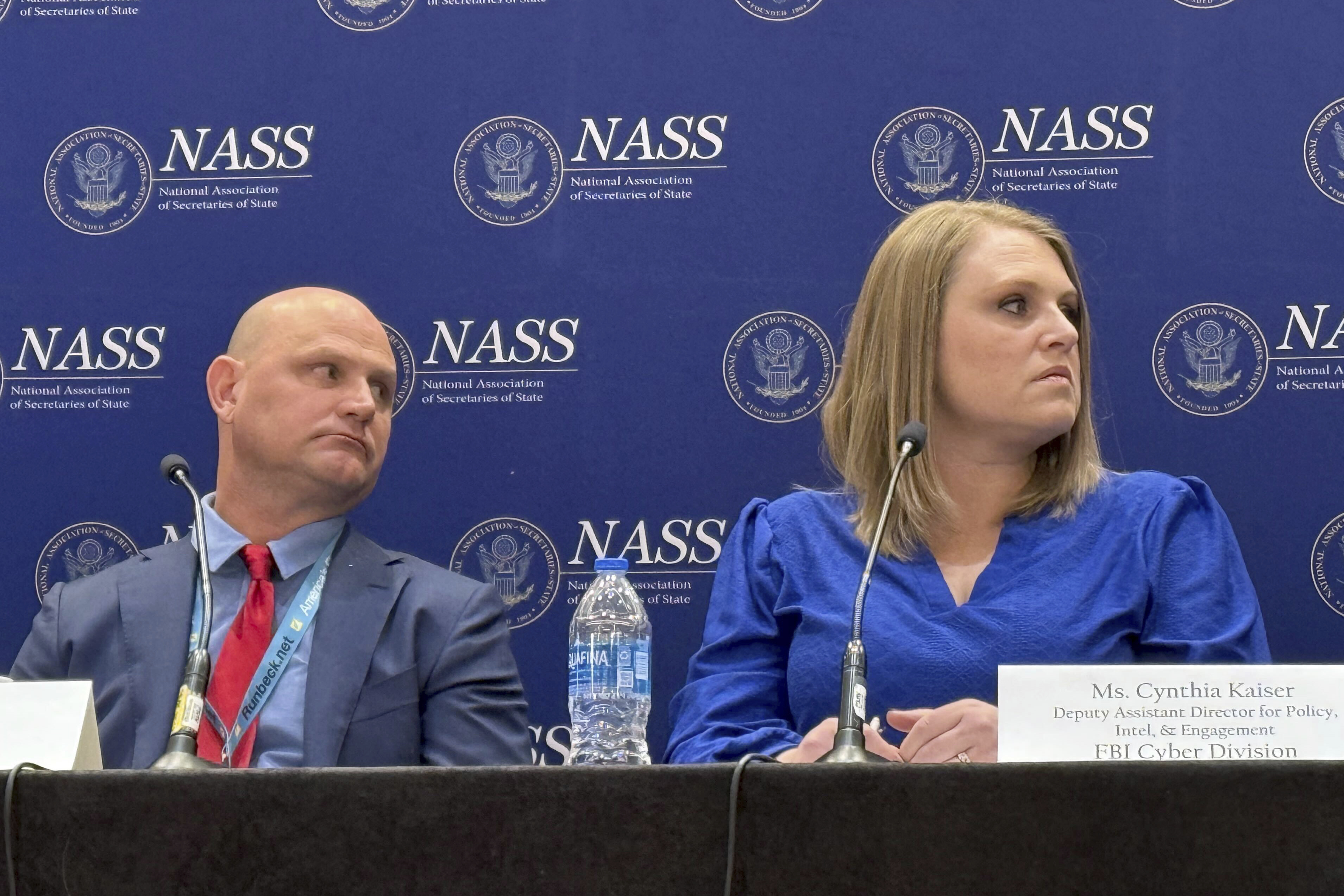 Kansas Secretary of State Scott Schwab, left, and Cynthia Kaiser, a deputy assistant director in the FBI's Cyber Division, participate in a meeting of the National Association of Secretaries of State in Washington, Thursday, Jan. 30, 2025. (AP Photo/Christina A. Cassidy)