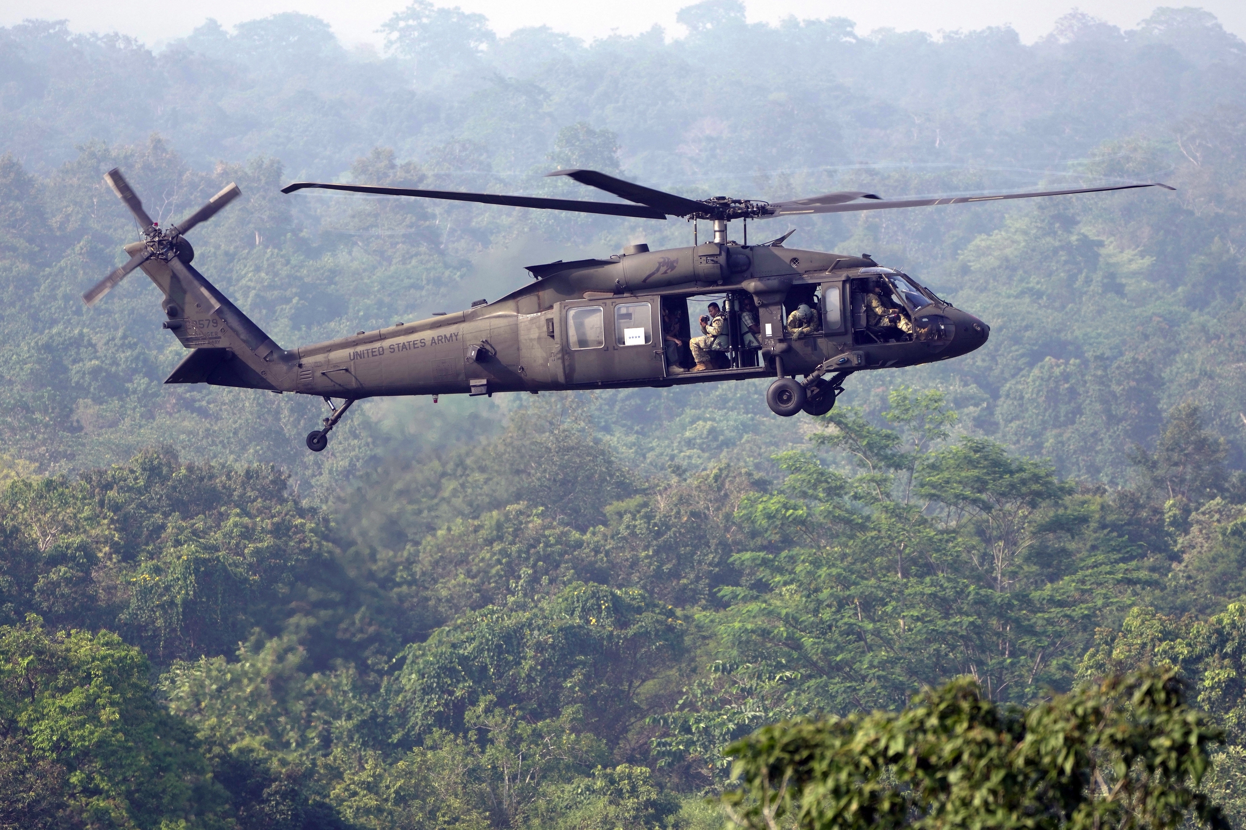 FILE - A U.S. Army Black Hawk helicopter flies during Super Garuda Shield 2022 joint military exercises in Baturaja, South Sumatra, Indonesia, Aug. 12, 2022. (AP Photo/Dita Alangkara, File)