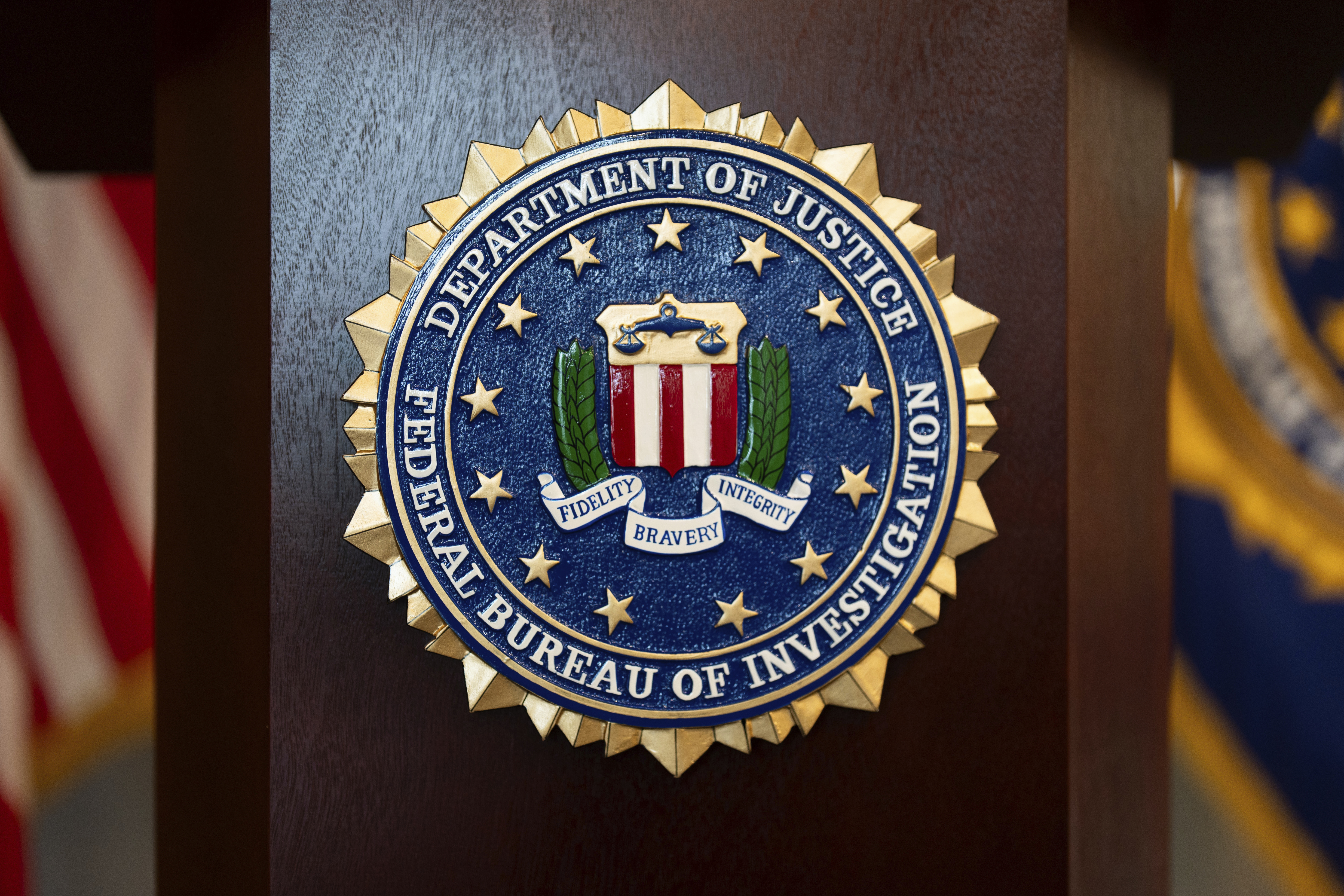 FILE - An FBI seal is displayed on a podium before a news conference at the field office in Portland, Ore., Thursday, Jan. 16, 2025. (AP Photo/Jenny Kane, File)