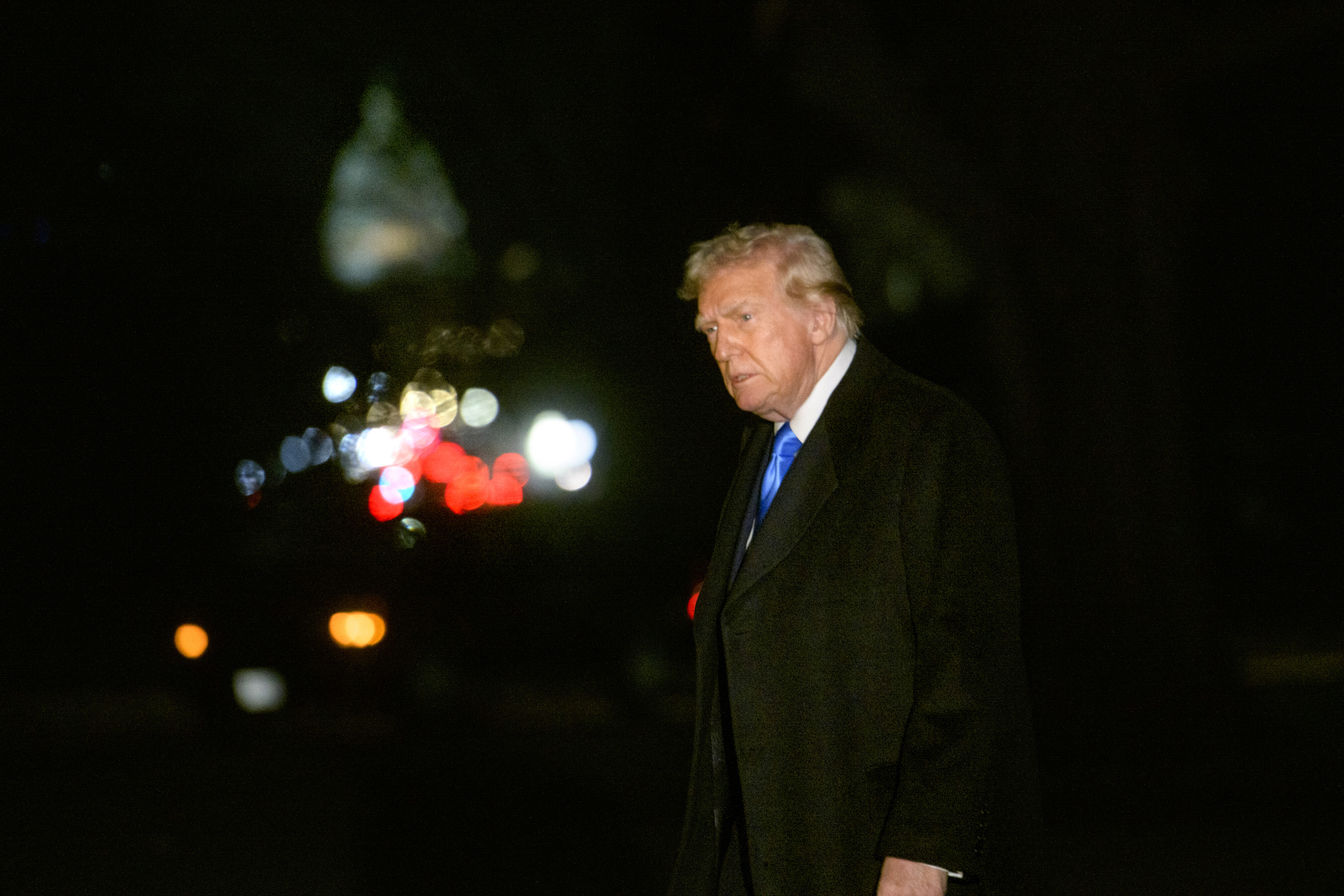 President Donald Trump walks from Marine One upon arrival on the South Lawn of the White House in Washington, Sunday, Feb. 2, 2025. (AP Photo/Rod Lamkey, Jr.)