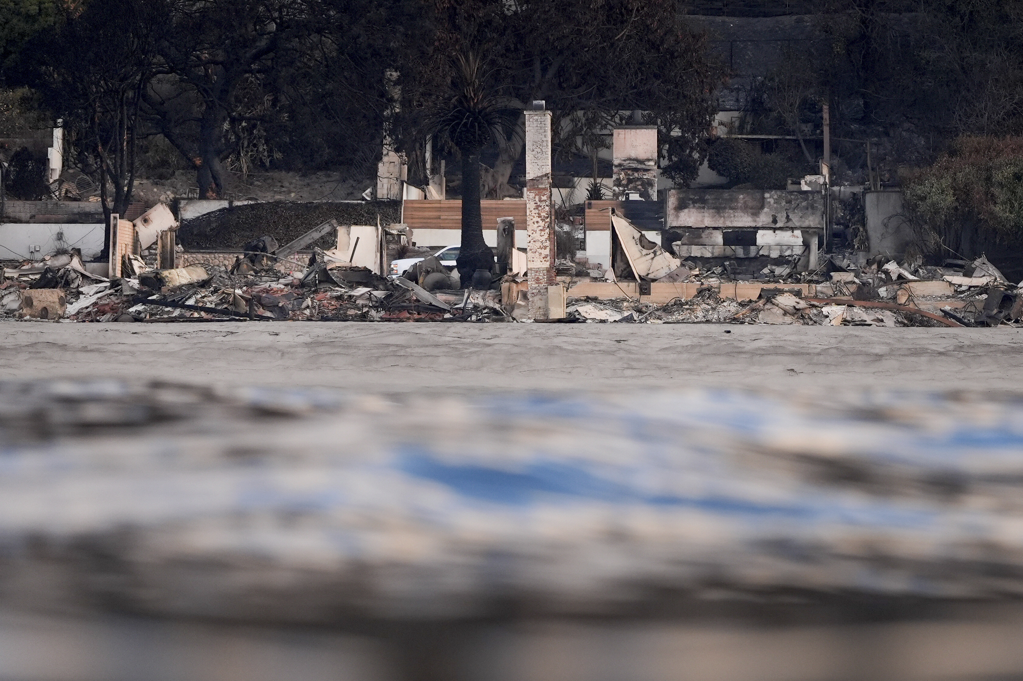 FILE - Properties damaged by the Palisades Fire are seen from a coastline perspective Friday, Jan. 17, 2025 in Malibu, Calif. (AP Photo/Carolyn Kaster, File)