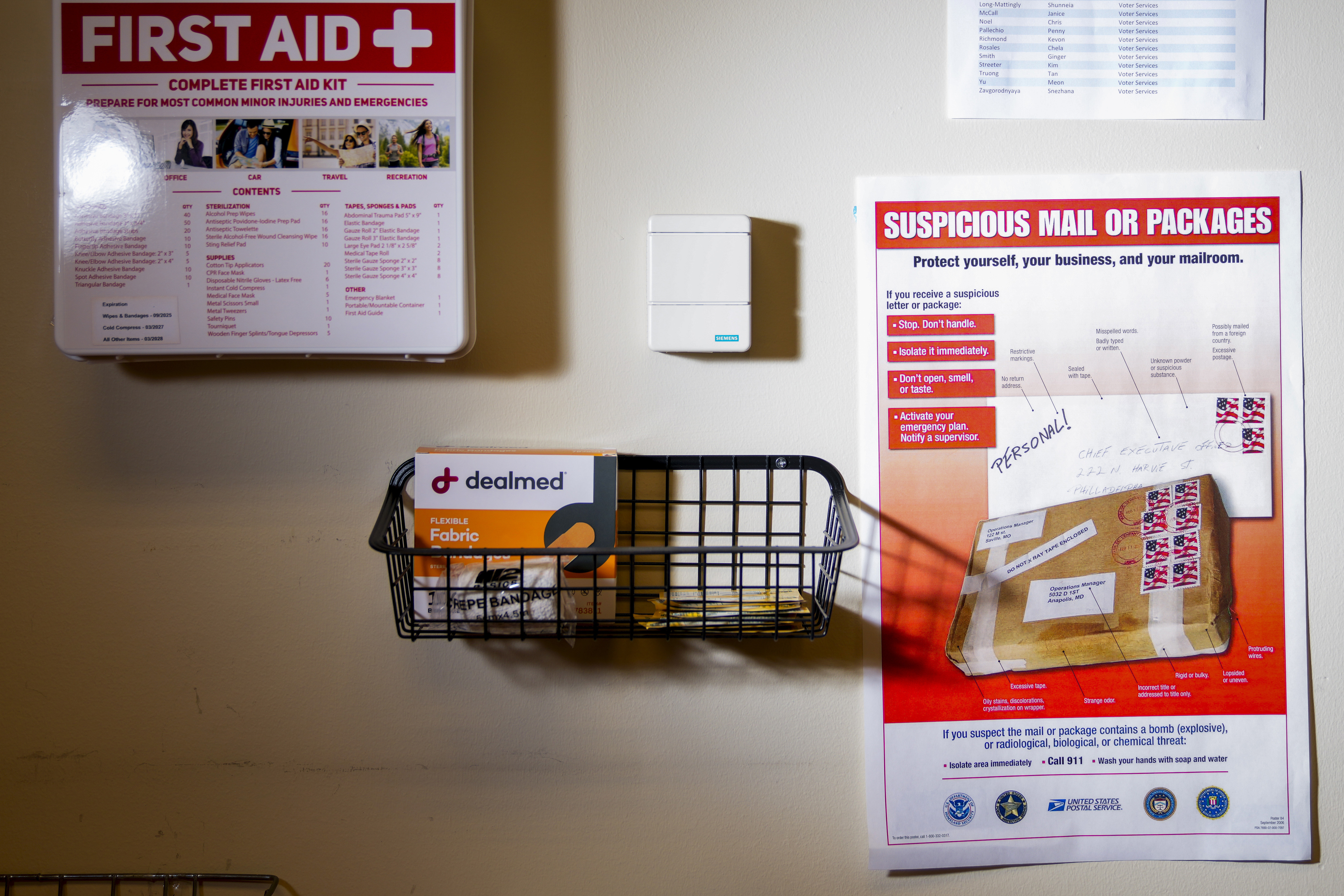 FILE - A United States Postal Service flyer about suspicious mail or packages is seen in the mail room at the King County Elections headquarters, Nov. 17, 2023, in Renton, Wash. The office began stocking Narcan, the nasal spray version of overdose-reversal drug naloxone, after receiving a letter laced with fentanyl in the summer and was evacuated the day after Election Day after receiving a similar envelope. (AP Photo/Lindsey Wasson, File)