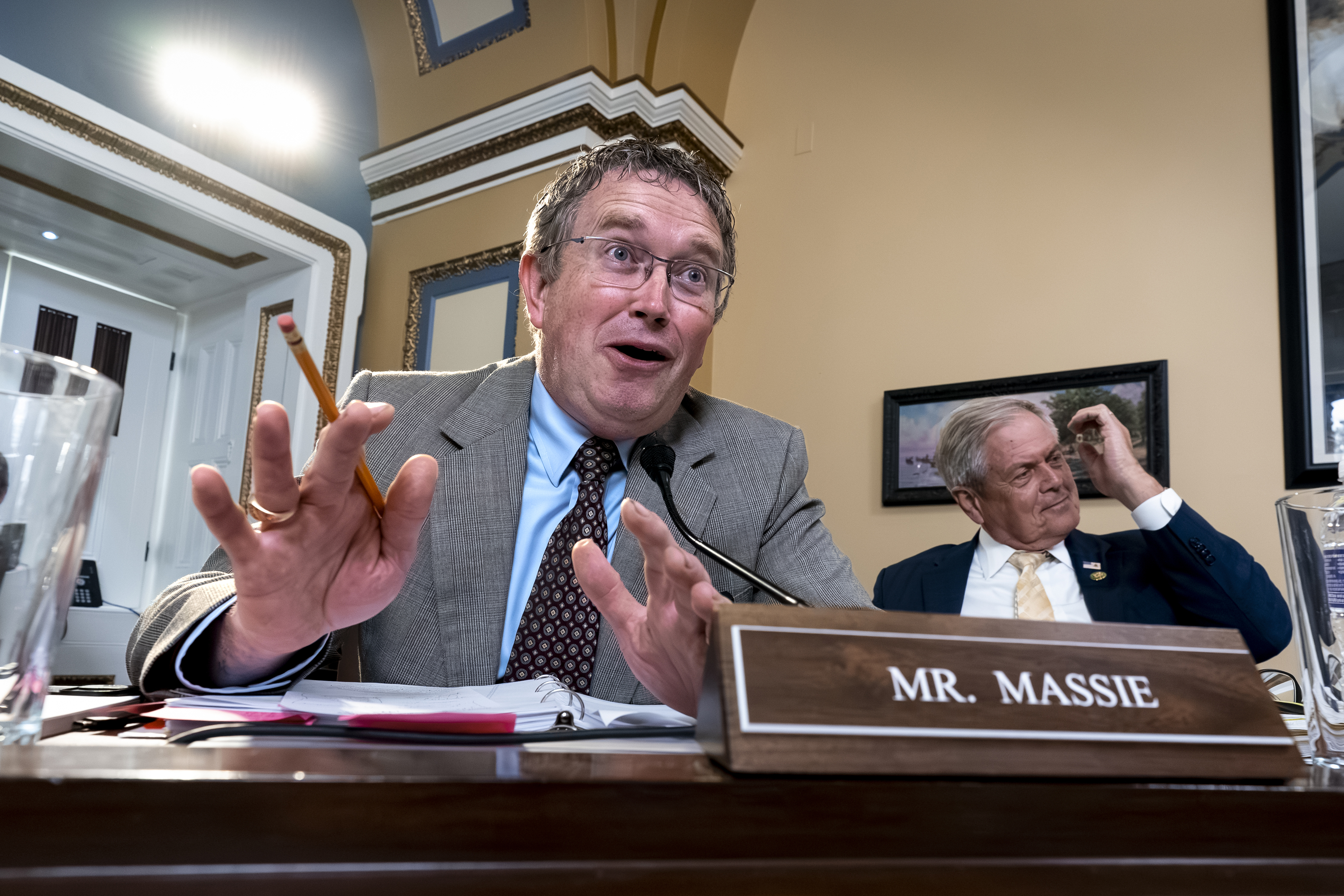 FILE - Rep. Thomas Massie, R-Ky., joined at right by Rep. Ralph Norman, R-S.C., both members of the conservative House Freedom Caucus, speaks as the House Rules Committee meets to prepare the debt limit bill, at the Capitol in Washington, May 30, 2023. (AP Photo/J. Scott Applewhite, File)